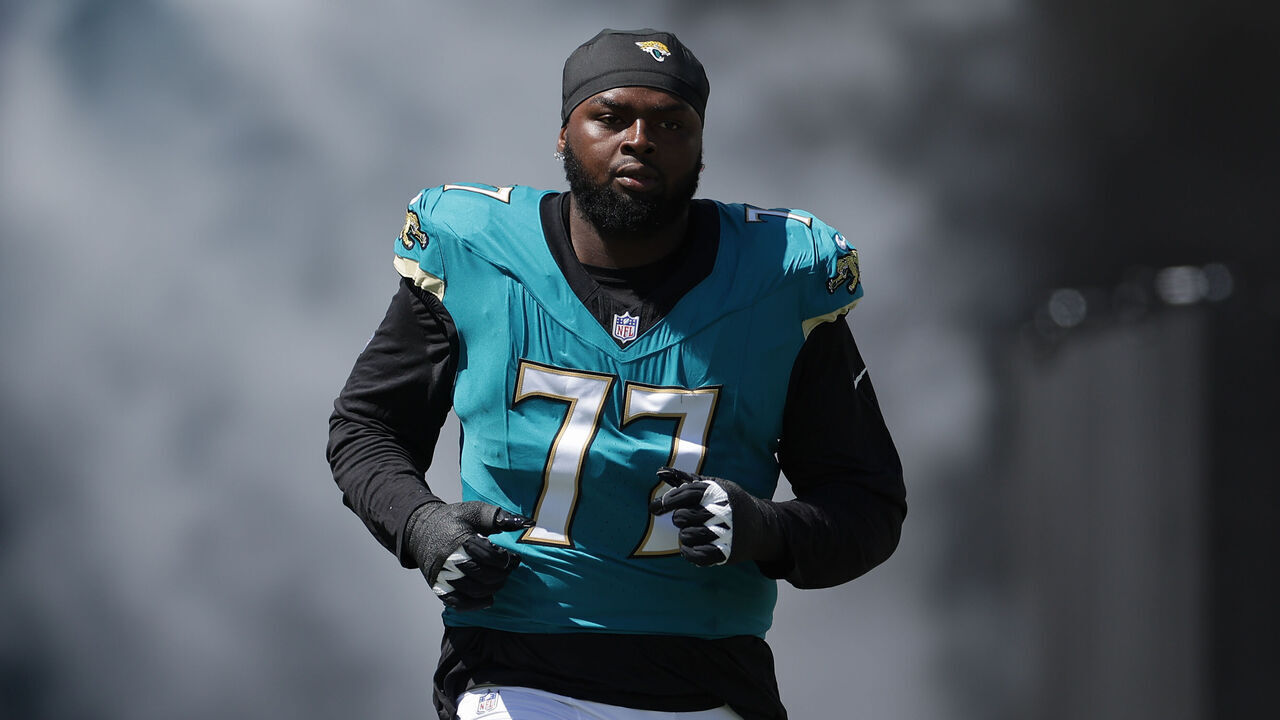 JACKSONVILLE, FL - SEPTEMBER 27: Anton Harrison #77 of the Jacksonville Jaguars runs out on the field before the game between the Jacksonville Jaguars and the New England Patriots on September 27, 2026 at EverBank Stadium in Jacksonville, Fl.