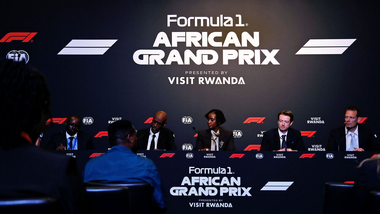 KIGALI, RWANDA - OCTOBER 13: (L-R) Paul Ntambera, Head of Communications of Rwanda Development Board, Jean-Guy Afrika, CEO of Rwanda Development Board, Nelly Mukayzayire, Minister for Sport of Republic of Rwanda, Carsten Tilke, Managing Director of Tilke GmbH & Co. KG, Alex Wurz, former F1 driver talk on stage during a Formula 1 announcement at BK Arena on October 13, 2026 in Kigali, Rwanda.