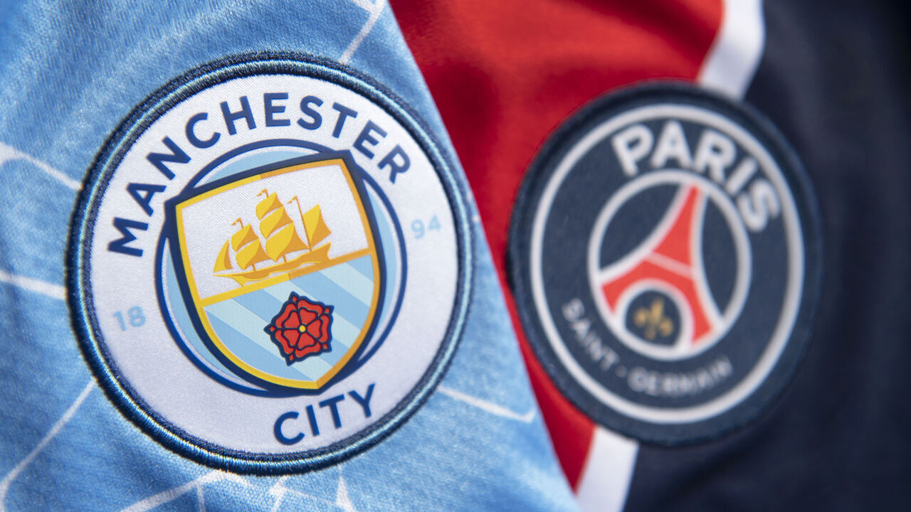 MANCHESTER, ENGLAND - APRIL 21: The club badges of Manchester City and Paris Saint-Germain on their first team home shirts ahead of their UEFA Champions League semi final on April 21, 2021 in Manchester, United Kingdom.