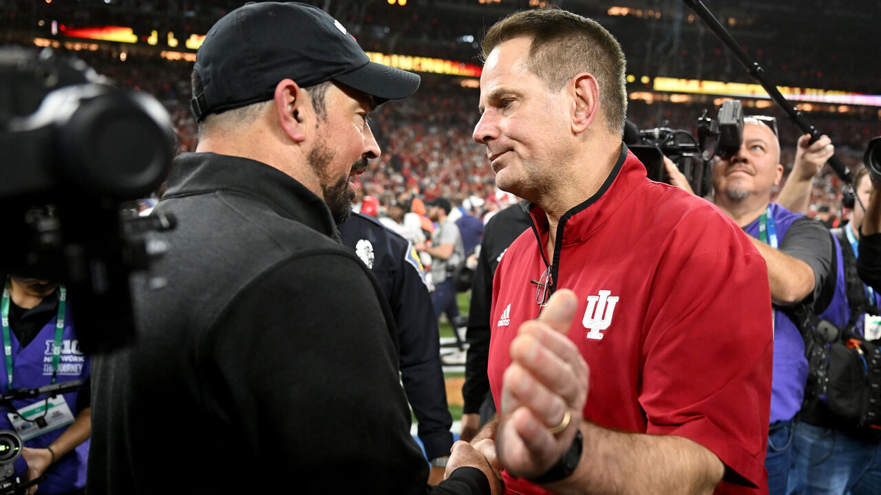 INDIANAPOLIS, INDIANA - DECEMBER 06: Head coach Curt Cignetti of the Indiana Hoosiers talks with head coach Ryan Day of the Ohio State Buckeyes after a 13-10 victory in the 2025 Big Ten Football Championship at Lucas Oil Stadium on December 06, 2025 in Indianapolis, Indiana.