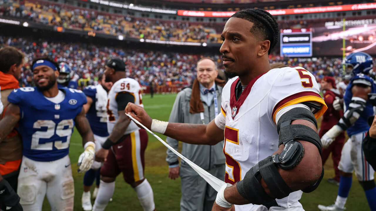 LANDOVER, MARYLAND - OCTOBER 11: Jayden Daniels #5 of the Washington Commanders looks on after the NFL game against the New York Giants at Northwest Stadium on October 11, 2026 in Landover, Maryland.