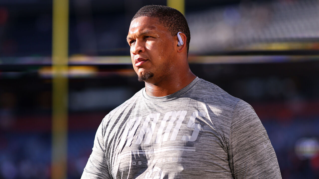 DENVER, COLORADO - SEPTEMBER 27: Alaric Jackson #77 of the Los Angeles Rams warms up prior to the game against the Denver Broncos at Empower Field at Mile High on September 27, 2026 in Denver, Colorado.