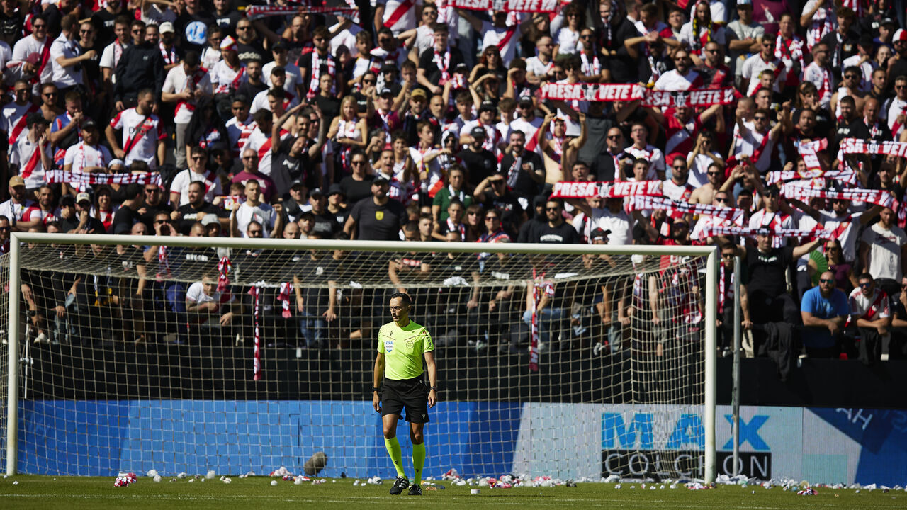 MADRID, SPAIN - OCTOBER 10: Referee Jose Maria Sanchez Martinez inspects the pitch after Rayo Vallecano supporters throw paper balls and paper airplanes onto the field during the LaLiga EA Sports 2026/27 match between Rayo Vallecano de Madrid and Athletic Club at Estadio de Vallecas on October 10, 2026 in Madrid, Spain.