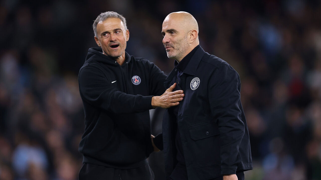 MANCHESTER, ENGLAND - OCTOBER 14: Enzo Maresca, Manager of Manchester City interacts with Luis Enrique, Head Coach of Paris Saint-Germain after the UEFA Champions League 2026/27 League Phase MD2 match between Manchester City and Paris Saint-Germain at City of Manchester Stadium on October 14, 2026 in Manchester, England.