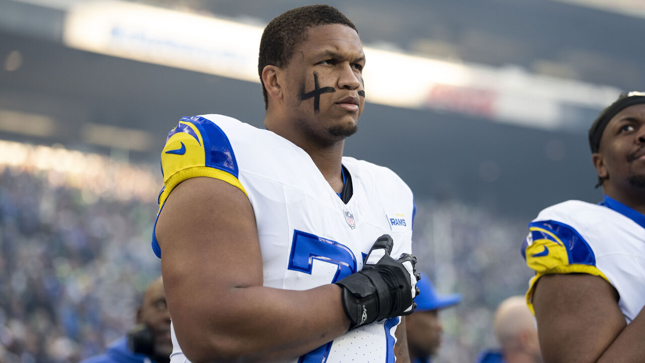 SEATTLE, WASHINGTON - JANUARY 25: Alaric Jackson #77 of the Los Angeles Rams looks on during the national anthem prior to an NFC Championship NFL football game against the Seattle Seahawks at Lumen Field on January 25, 2026 in Seattle, Washington.