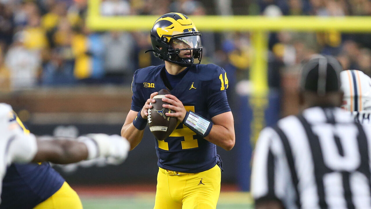 ANN ARBOR, MI - SEPTEMBER 19: Michigan Wolverines quarterback Tommy Carr (14) looks for a receiver during a play during a regular season non-conference college football game between the UTEP Miners and the Michigan Wolverines on September 19, 2026 at Michigan Stadium in Ann Arbor, Michigan.