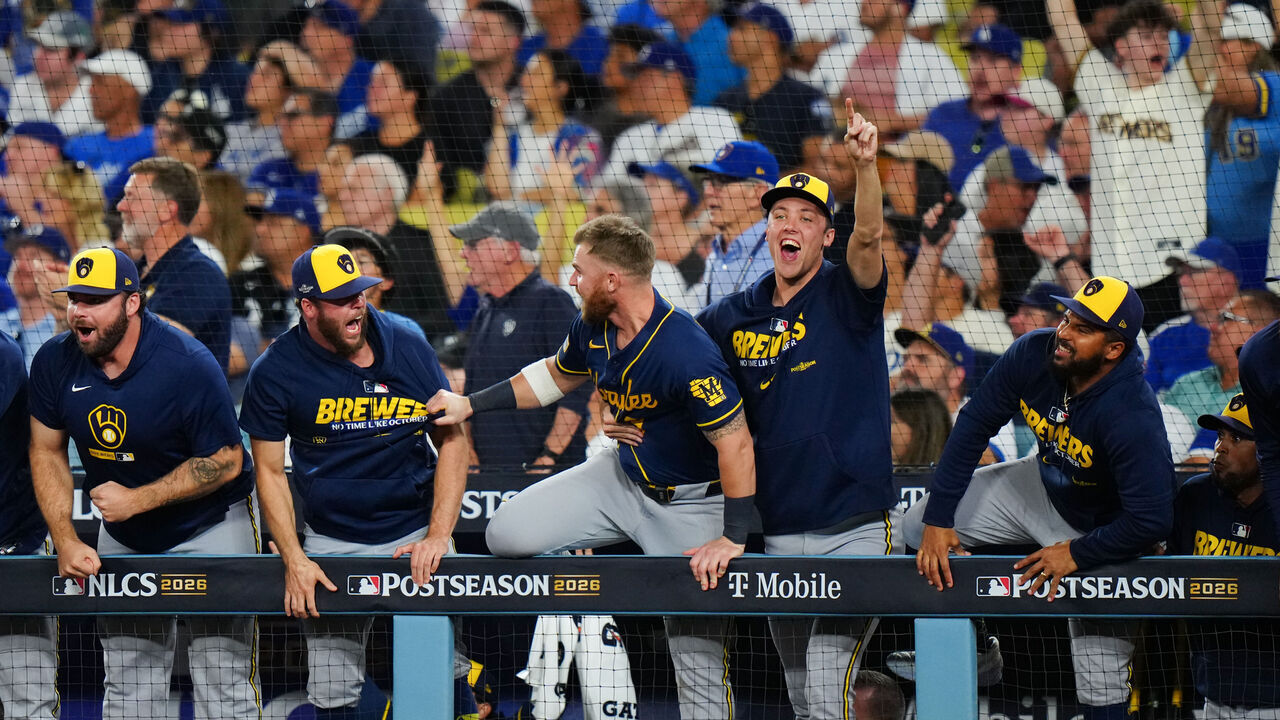 LOS ANGELES, CA - OCTOBER 15: Members of the Milwaukee Brewers celebrate in the dugout after Garrett Mitchell #5 hit a solo home run to take the lead in the sixth inning during Game Four of the National League Championship Series between the Milwaukee Brewers and the Los Angeles Dodgers at UNIQLO Field at Dodger Stadium on Thursday, October 15, 2026 in Los Angeles, California.
