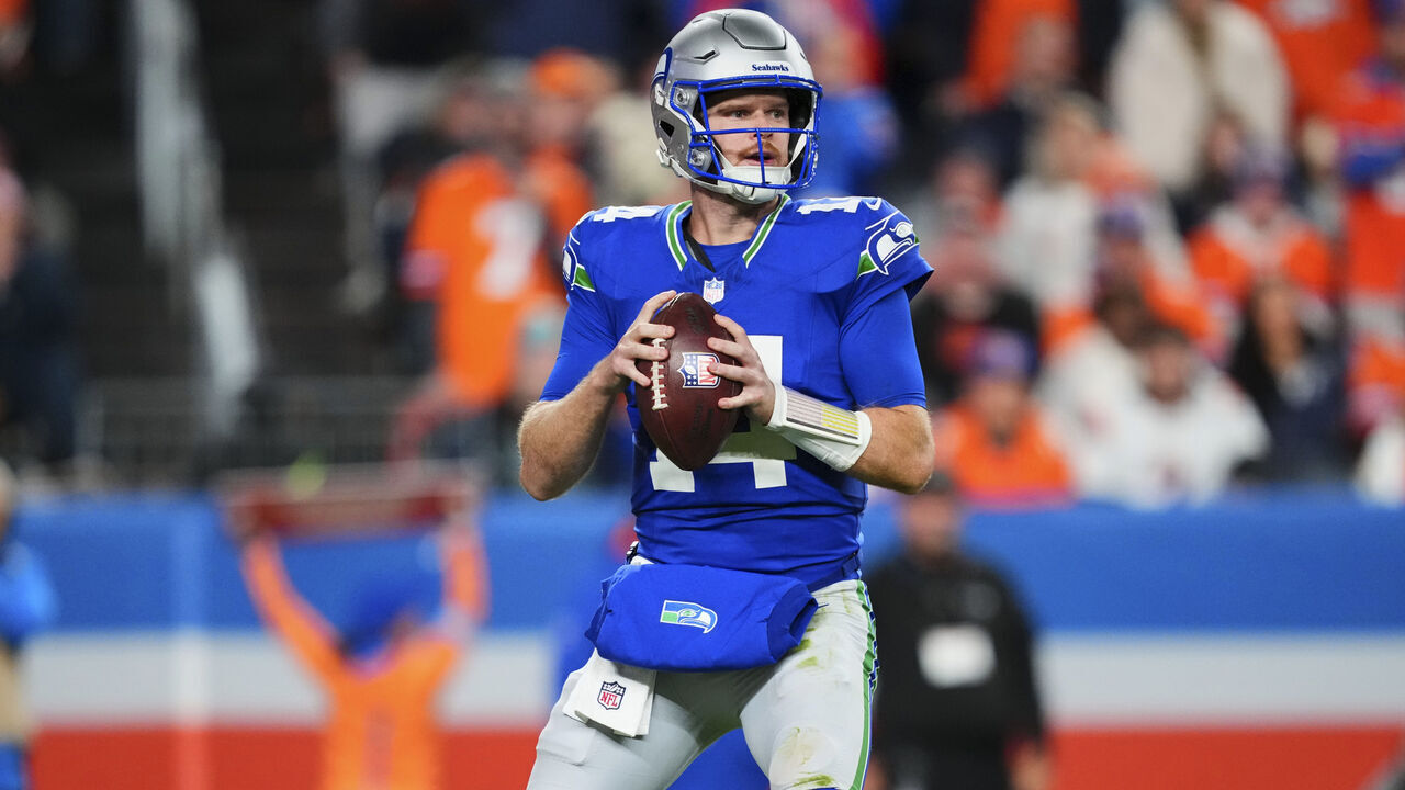 SEATTLE, CO - OCTOBER 15: Sam Darnold #14 of the Seattle Seahawks drops back to pass against the Denver Broncos during an NFL football game at Empower Field at Mile High on October 15, 2026 in Seattle, Colorado.