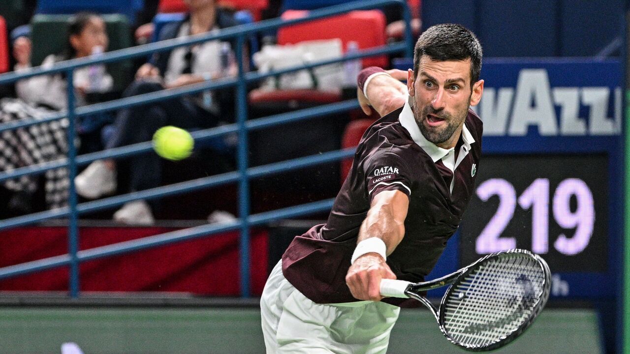 Serbia's Novak Djokovic hits a return to Poland's Hubert Hurkacz during their men's singles match at the Shanghai Masters tennis tournament in Shanghai on October 9, 2026.