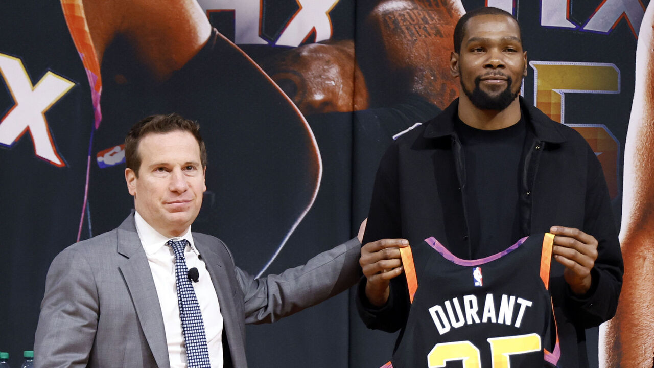 PHOENIX, ARIZONA - FEBRUARY 16: (L-R) Owner Mat Ishbia, Kevin Durant and general manager James Jones of the Phoenix Suns pose for a photo at a press conference at Footprint Center on February 16, 2023 in Phoenix, Arizona. NOTE TO USER: User expressly acknowledges and agrees that, by downloading and/or using this photograph, User is consenting to the terms and conditions of the Getty Images License Agreement.