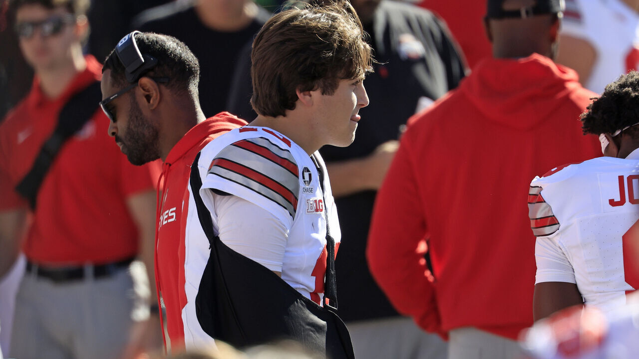 BLOOMINGTON, INDIANA - OCTOBER 17: Julian Sayin #10 of the Ohio State Buckeyes looks on from the sidelines with his arm in a sling during the fourth quarter against the Indiana Hoosiers at Memorial Stadium on October 17, 2026 in Bloomington, Indiana.