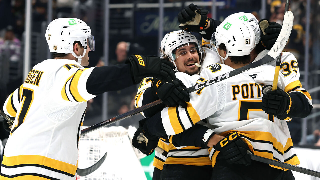LOS ANGELES, CALIFORNIA - OCTOBER 17: Marat Khusnutdinov #92 of the Boston Bruins celebrates his go ahead goal with Morgan Geekie #39, Matthew Poitras #51 and Will Borgen #17, to take a 2-1 lead over the Los Angeles Kings, during the third period in a 4-1 Bruins win at Crypto.com Arena on October 17, 2026 in Los Angeles, California.