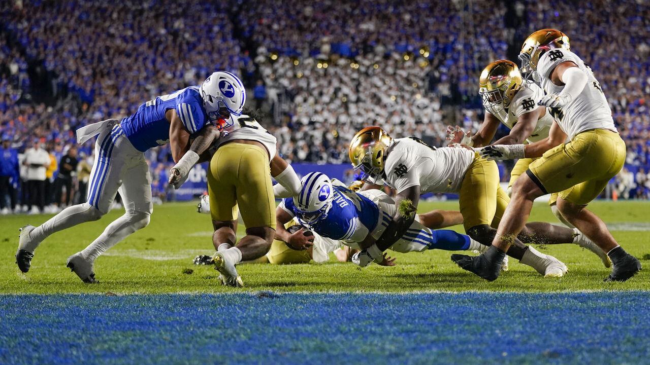 PROVO, UT - OCTOBER 17: BYU Cougars quarterback Bear Bachmeier (47) dives forward with the ball during a college football game between the Notre Dame Fighting Irish and the BYU Cougars on October 17, 2026 at LaVell Edwards Stadium in Provo, UT.