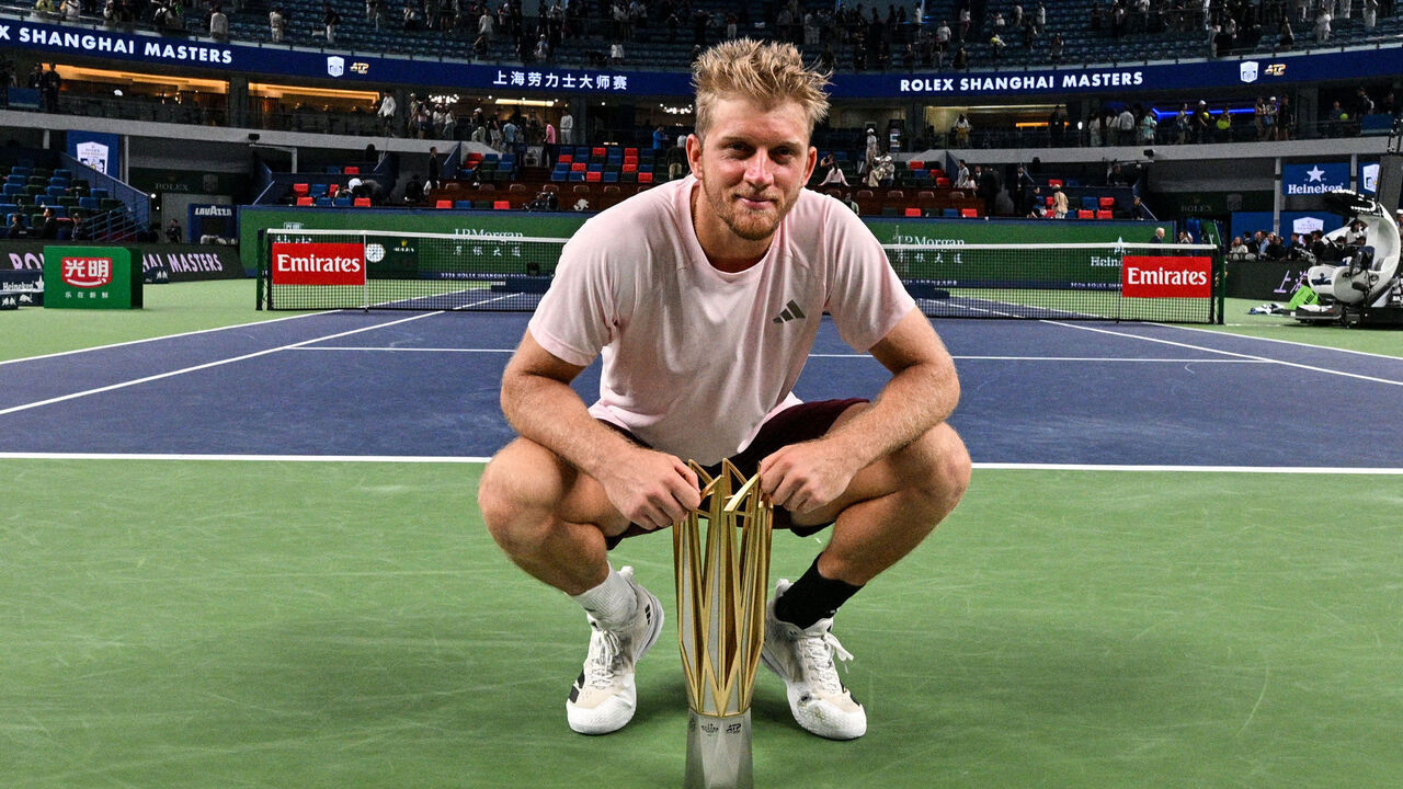 Spain's Alejandro Davidovich Fokina poses with the trophy after his victory against Spain's Rafael Jodar during their men's singles final match at the Shanghai Masters tennis tournament in Shanghai on October 18, 2026.