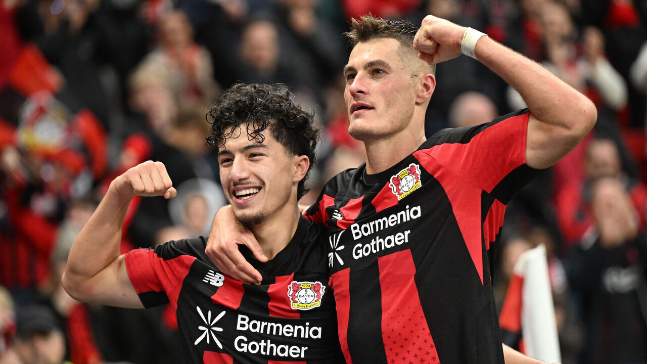 Bayer Leverkusen's Czech forward #14 Patrik Schick celebrates scoring his team's second goal with Bayer Leverkusen's Algerian midfielder #30 Ibrahim Maza during the German first division Bundesliga football match between Bayer Leverkusen and SC Freiburg in Leverkusen, western Germany, on October 18, 2026. / DFL REGULATIONS PROHIBIT ANY USE OF PHOTOGRAPHS AS IMAGE SEQUENCES AND/OR QUASI-VIDEO