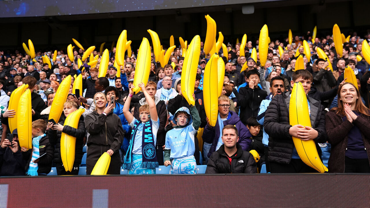 Manchester City fans with inflatable bananas in the stands ahead of the Premier League match at the Etihad Stadium, Manchester. Picture date: Saturday October 17, 2026.