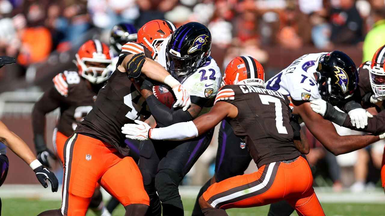CLEVELAND, OH - OCTOBER 18: A hit by Cleveland Browns linebacker Carson Schwesinger (49) forces Baltimore Ravens running back Derrick Henry (22) to fumble during the fourth quarter of the National Football League game between the Baltimore Ravens and Cleveland Browns on October 18, 2026, at Huntington Bank Field in Cleveland, OH.