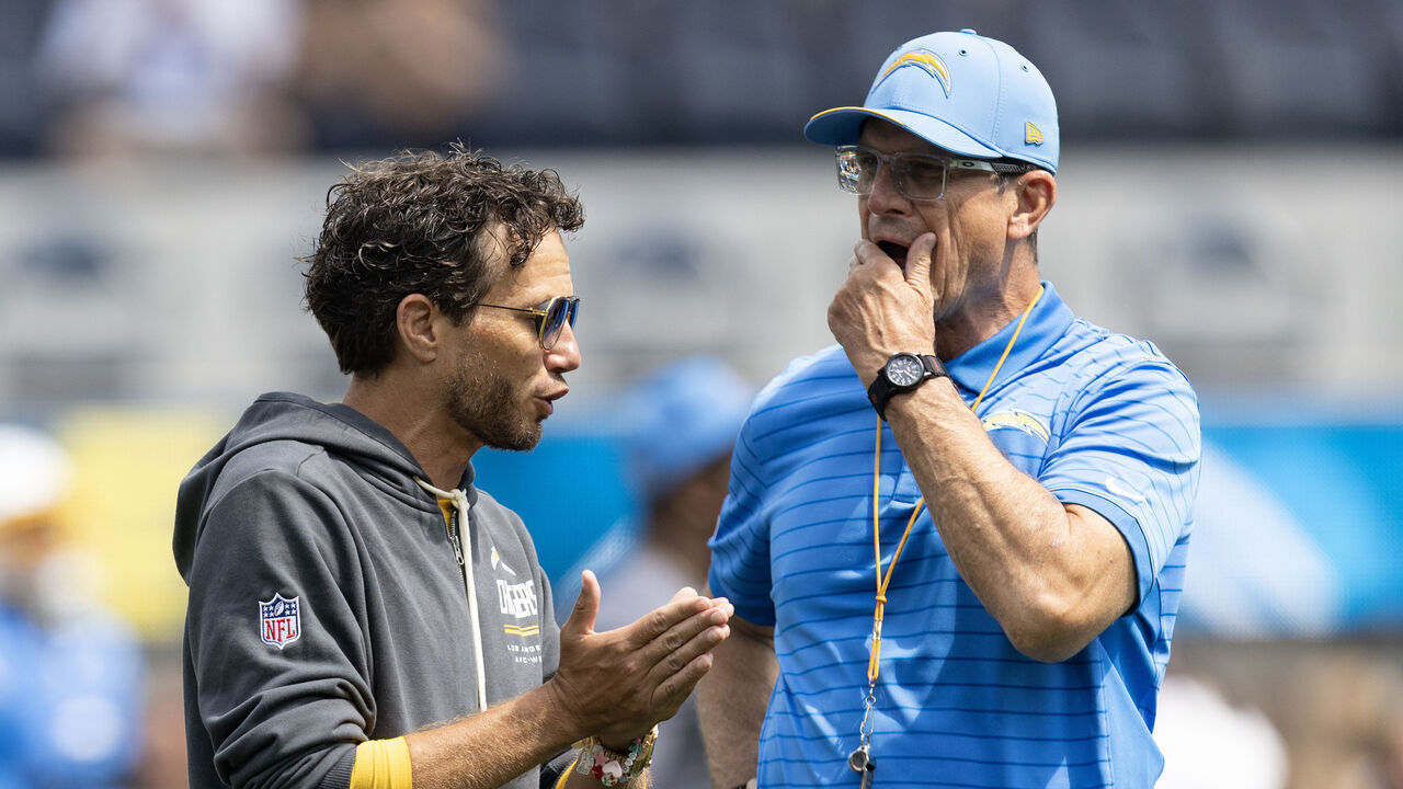 Inglewood, CA - The Los Angeles Chargers offensive coordinator Mike McDaniel speaks with head coach Jim Harbaugh on Sunday, Sept. 13, 2026, before the season opener against the Arizona Cardinals at SoFi Stadium in Inglewood, CA. The Chargers host the Cardinals at home to open their season.