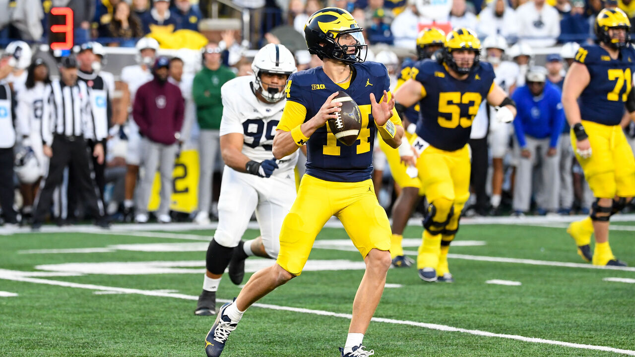 ANN ARBOR, MICHIGAN - OCTOBER 17: Tommy Carr #14 of the Michigan Wolverines looks to throw the ball downfield during the second half of a college football game against the Penn State Nittany Lions at Michigan Stadium on October 17, 2026 in Ann Arbor, Michigan. The Michigan Wolverines won the game 21-18.