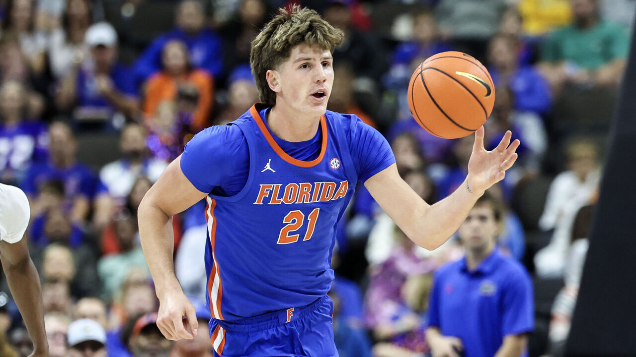 JACKSONVILLE, FLORIDA - OCTOBER 18: Alex Condon #21 of the Florida Gators brings the ball up court during the first half of the game against the Baylor Bears at VyStar Veterans Memorial Arena on October 18, 2026 in Jacksonville, Florida.