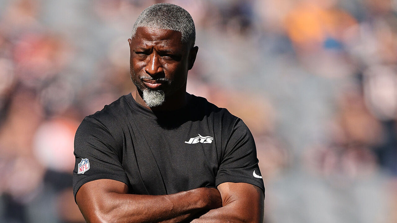 CHICAGO, ILLINOIS - OCTOBER 04: Head coach Aaron Glenn of the New York Jets looks on from the field prior to the game against the Chicago Bears at Soldier Field on October 04, 2026 in Chicago, Illinois.