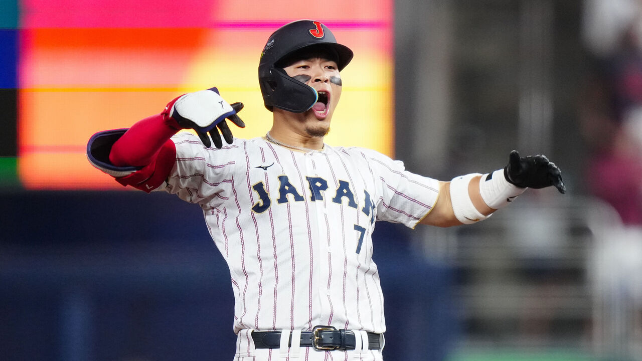 MIAMI, FL - MARCH 14: Teruaki Sato #7 of Team Japan reacts after hitting a one-run double to tie the game in the third inning during the 2026 World Baseball Classic Quarterfinals game presented by Capital One between Team Venezuela and Team Japan at loanDepot park on Saturday, March 14, 2026 in Miami, Florida.