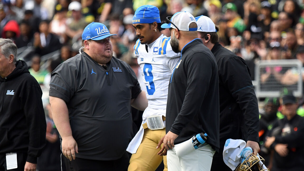 EUGENE, OR - OCTOBER 10: UCLA Bruins quarterback Nico Iamaleava (9) is assisted off the field after an injury during a college football game between the Oregon Ducks and UCLA Bruins on October 10, 2026 at Autzen Stadium in Eugene, Oregon.
