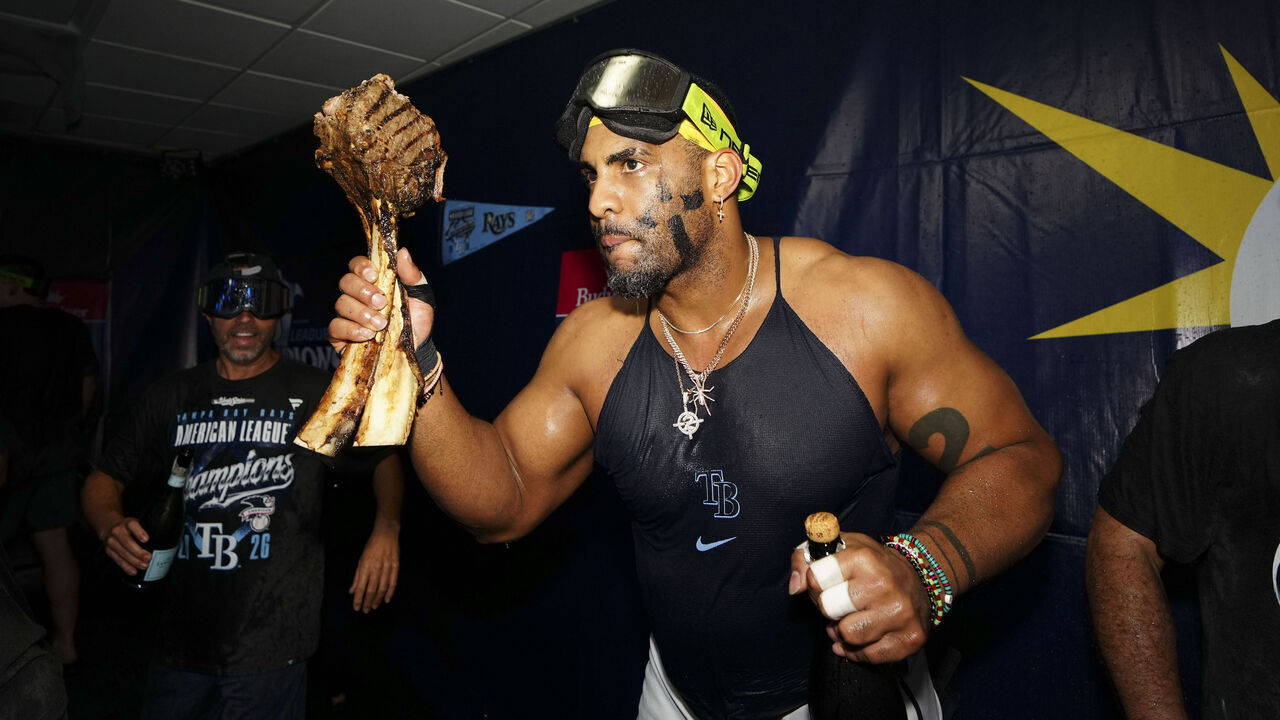 ST. PETERSBURG, FL - OCTOBER 19: Yandy Díaz #2 of the Tampa Bay Rays celebrates in the clubhouse after defeating the Cleveland Guardians during Game Six of the American League Championship Series at Tropicana Field on Monday, October 19, 2026 in St. Petersburg, Florida.