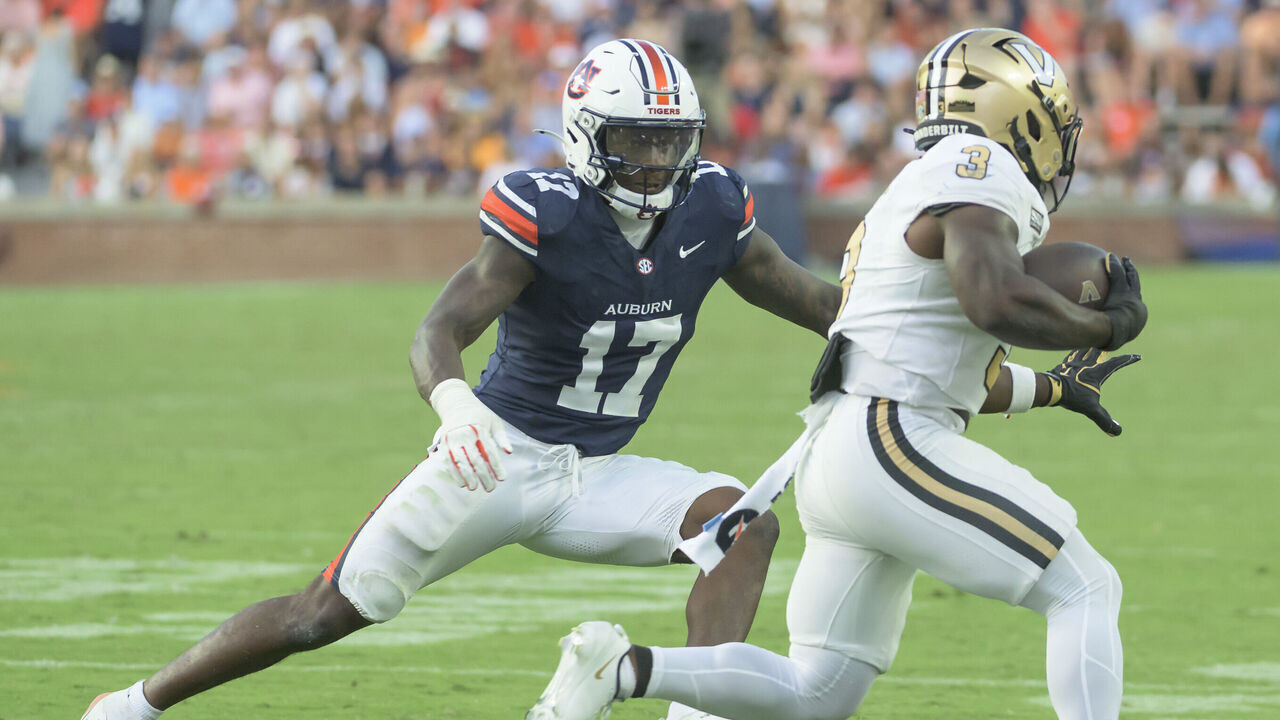 AUBURN, ALABAMA - SEPTEMBER 26: Linebacker Xavier Atkins #17 of the Auburn Tigers looks to tackle running back Jamezell Lassiter #3 of the Vanderbilt Commodores at Jordan-Hare Stadium on September 26, 2026 in Auburn, Alabama.