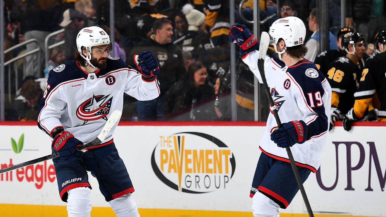 PITTSBURGH, PA - JANUARY 7: Kirill Marchenko #86 celebrates with Adam Fantilli #19 of the Columbus Blue Jackets after a 4-3 shootout win over the Pittsburgh Penguins at PPG PAINTS Arena on January 7, 2025 in Pittsburgh, Pennsylvania.