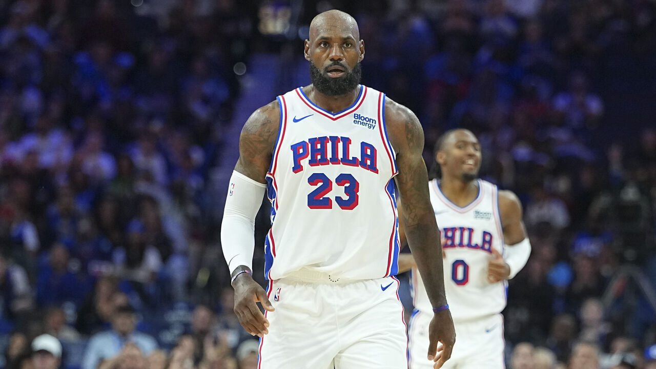 PHILADELPHIA, PENNSYLVANIA - OCTOBER 16: LeBron James #23 and Tyrese Maxey #0 of the Philadelphia 76ers look on against the Boston Celtics during the preseason game at Xfinity Mobile Arena on October 16, 2026 in Philadelphia, Pennsylvania.