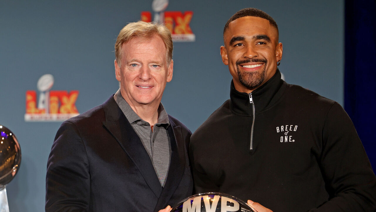 NEW ORLEANS, LOUISIANA - FEBRUARY 10: NFL commissioner Roger Goodell (L) hands the MVP Trophy to quarterback Jalen Hurts #1 of the Philadelphia Eagles during the Host Committee Handoff Press Conference at the Ernest N. Morial Convention Center on February 10, 2025 in New Orleans, Louisiana. The Eagles defeated the Kansas City Chiefs 40-22 in the Caesars Superdome on Sunday night.