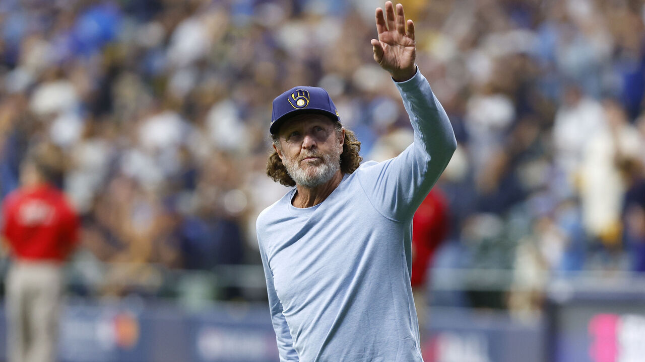 MILWAUKEE, WI - OCTOBER 03: Milwaukee Brewers hall of famer Robin Yount acknowledges the crowd during a 2024 National League Wild Card game between the Milwaukee Brewers and the New York Mets at American Family Field on October 3, 2024 in Milwaukee, WI.