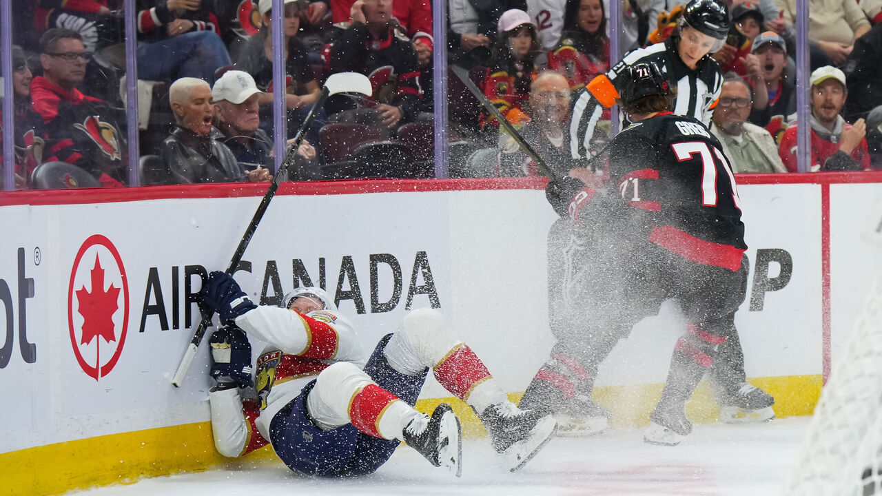 OTTAWA, CANADA - OCTOBER 21: Brady Tkachuk #8 of the Florida Panthers falls to the ice after a body check by Ridly Greig #71 of the Ottawa Senators during the second period on October 21, 2026 at Canadian Tire Centre in Ottawa, Ontario, Canada.