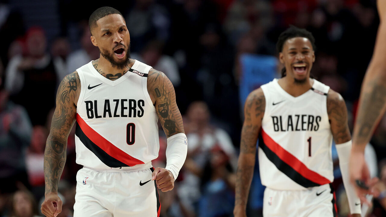 PORTLAND, OREGON - OCTOBER 21: Damian Lillard #0 and Ja Morant #1 of the Portland Trail Blazers react after a basket against the Phoenix Suns during the second half at Moda Center on October 21, 2026 in Portland, Oregon. NOTE TO USER: User expressly acknowledges and agrees that, by downloading and/or using this photograph, user is consenting to the terms and conditions of the Getty Images License Agreement.