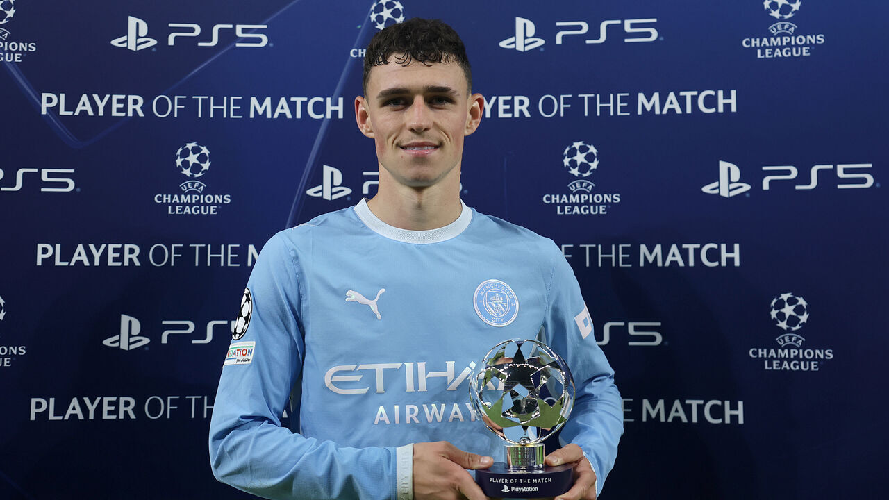 MANCHESTER, ENGLAND - OCTOBER 20: Phil Foden of Manchester City poses for a photo with the Playstation Player of the Match trophy following the UEFA Champions League 2026/27 League Phase MD3 match between Manchester City and AEK Athens at City of Manchester Stadium on October 20, 2026 in Manchester, England.