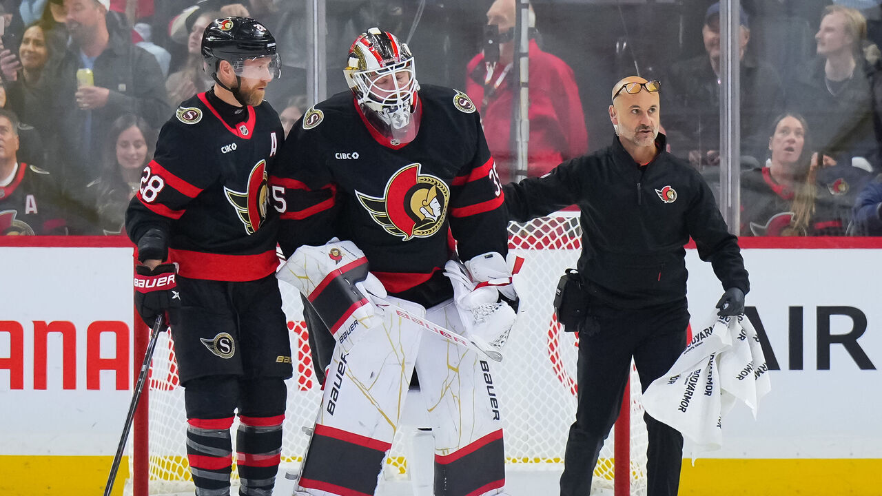 OTTAWA, CANADA - OCTOBER 21: Linus Ullmark #35 of the Ottawa Senators is helped off the ice by head athletic therapist Domenic Nicoletta and teammate Claude Giroux #28 during the third period of an NHL game against the Florida Panthers on October 21, 2026 at Canadian Tire Centre in Ottawa, Ontario, Canada.