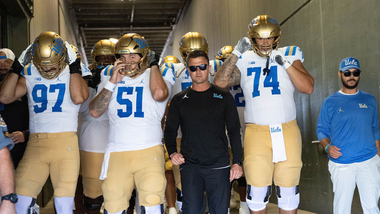 EUGENE, OREGON - OCTOBER 10: Bob Chesney of the UCLA Bruins leads his UCLA Bruins team to the field before their game against the Oregon Ducks at Autzen Stadium on October 10, 2026 in Eugene, Oregon.