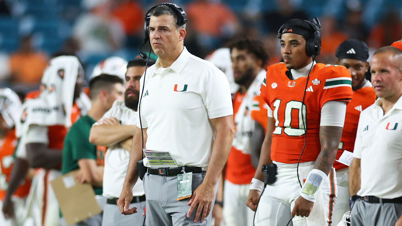 MIAMI GARDENS, FLORIDA - SEPTEMBER 10: Head coach Mario Cristobal and Darian Mensah #10 of the Miami Hurricanes look on during the second half of the game against the Florida A&M Rattlers at Hard Rock Stadium on September 10, 2026 in Miami Gardens, Florida.
