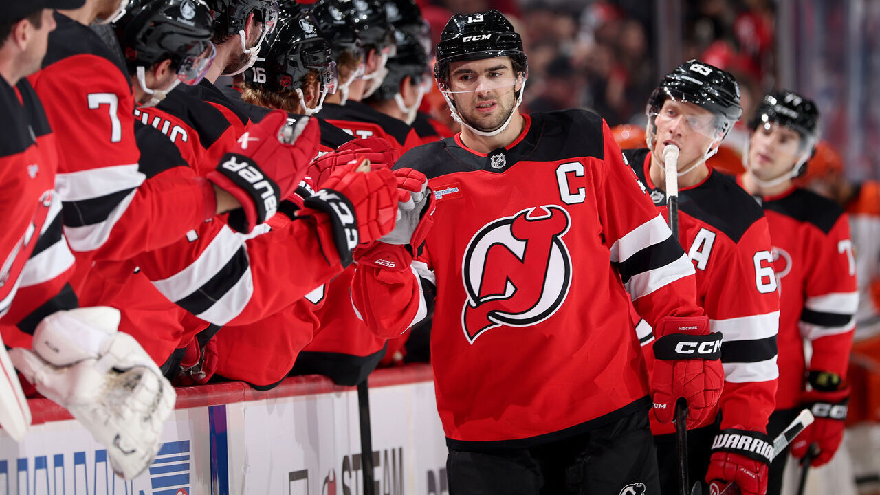 NEWARK, NEW JERSEY - OCTOBER 22: Nico Hischier #13 of the New Jersey Devils celebrates his goal with teammates on the bench during the first period against the Anaheim Ducks at Prudential Center on October 22, 2026 in Newark, New Jersey.