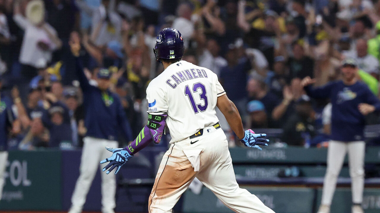 ST. PETERSBURG, FL - OCTOBER 19: Junior Caminero #13 of the Tampa Bay Rays celebrates as he rounds the bases after hitting a two-run home run in the seventh inning during Game Six of the American League Championship Series between the Cleveland Guardians and the Tampa Bay Rays at Tropicana Field on Monday, October 19, 2026 in St. Petersburg, Florida.