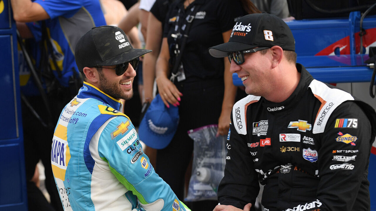 ATLANTA, GA - JULY 08: Chase Elliott (#9 Hendrick Motorsports NAPA/Children's Chevrolet) and Kyle Busch (#8 Richard Childress Racing Cheddar's Scratch Kitchen Chevrolet) talk during qualifying for the NASCAR Cup Series Quaker State 400 on July 08, 2023, at Atlanta Motor Speedway in Hampton, GA.