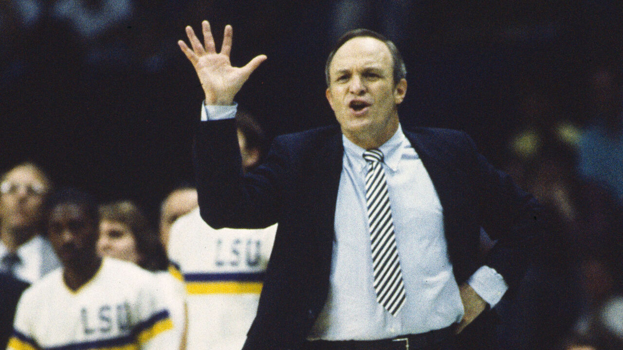 DALLAS, TX - MARCH 29: Head Coach Dale Brown of the LSU Tigers coaches against the Louisville Cardinals during the 1986 NCAA Men's Basketball Semifinals held at Reunion Arena on March 29, 1986 in Dallas, Texas. Louisville defeated LSU 88-77 to advance to the championship game.