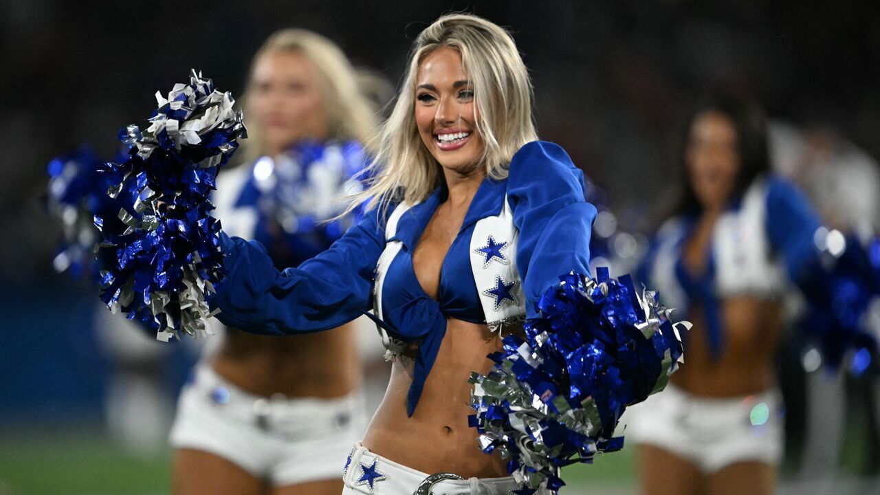 A Dallas Cowboys cheerleader performs during a break of the NFL match between the Dallas Cowboys and the Baltimore Ravens at the Maracana Stadium in Rio de Janeiro, Brazil, on September 27, 2026.
