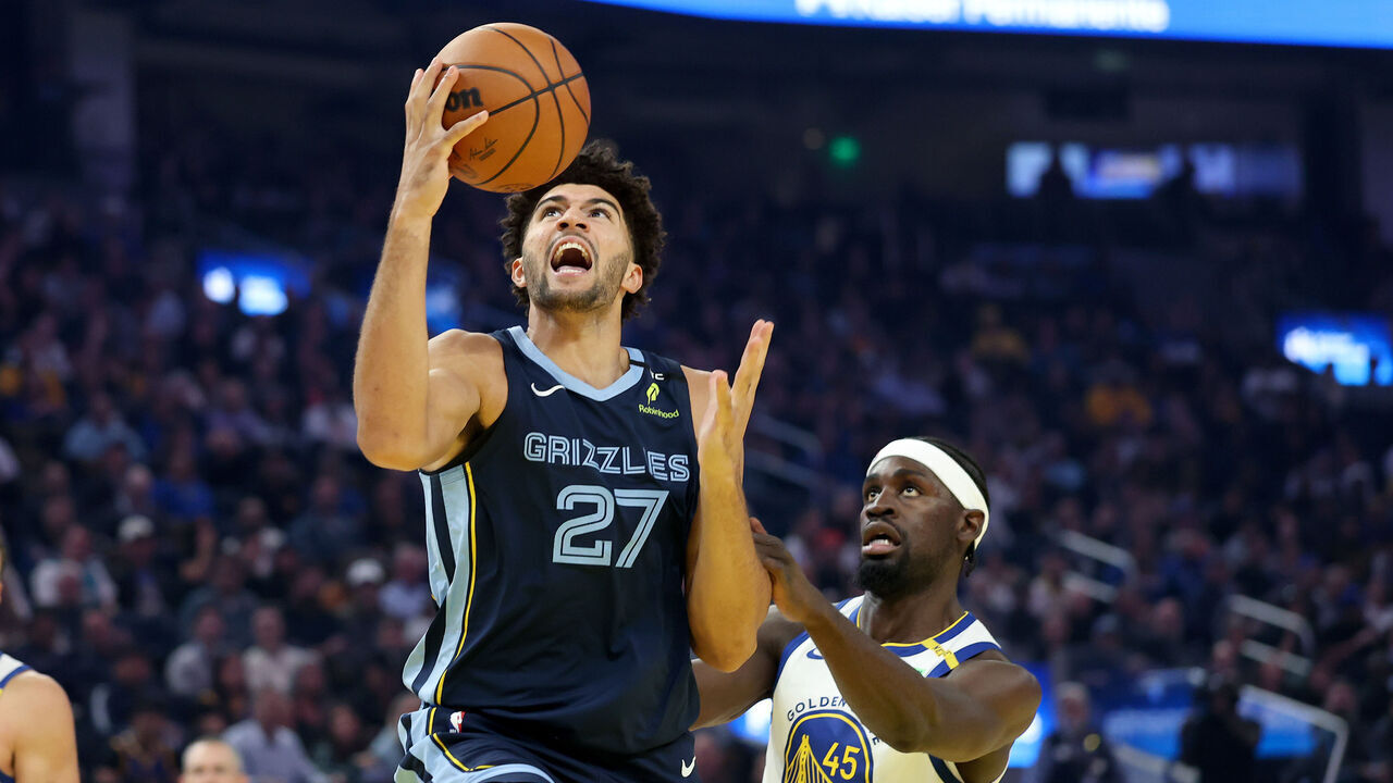 SAN FRANCISCO, CALIFORNIA - OCTOBER 23: Cameron Boozer #27 of the Memphis Grizzlies is fouled by GrahamIke #45 of the Golden State Warriors during the first half at Chase Center on October 23, 2026 in San Francisco, California. NOTE TO USER: User expressly acknowledges and agrees that, by downloading and/or using this photograph, user is consenting to the terms and conditions of the Getty Images License Agreement.
