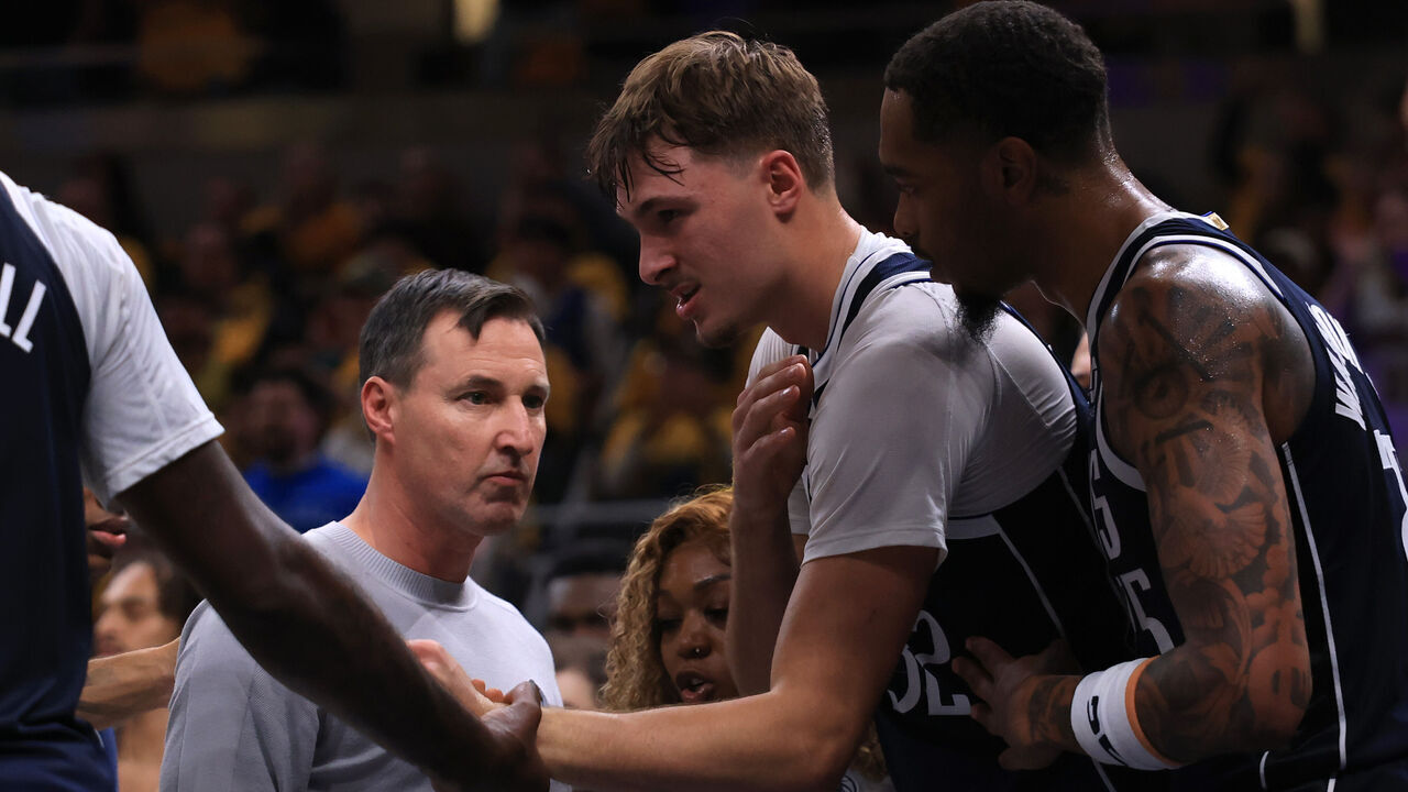 INDIANAPOLIS, INDIANA - OCTOBER 23: Cooper Flagg #32 of the Dallas Mavericks holds his shoulder after being fouled during the second quarter against the Indiana Pacers at Gainbridge Fieldhouse on October 23, 2026 in Indianapolis, Indiana.