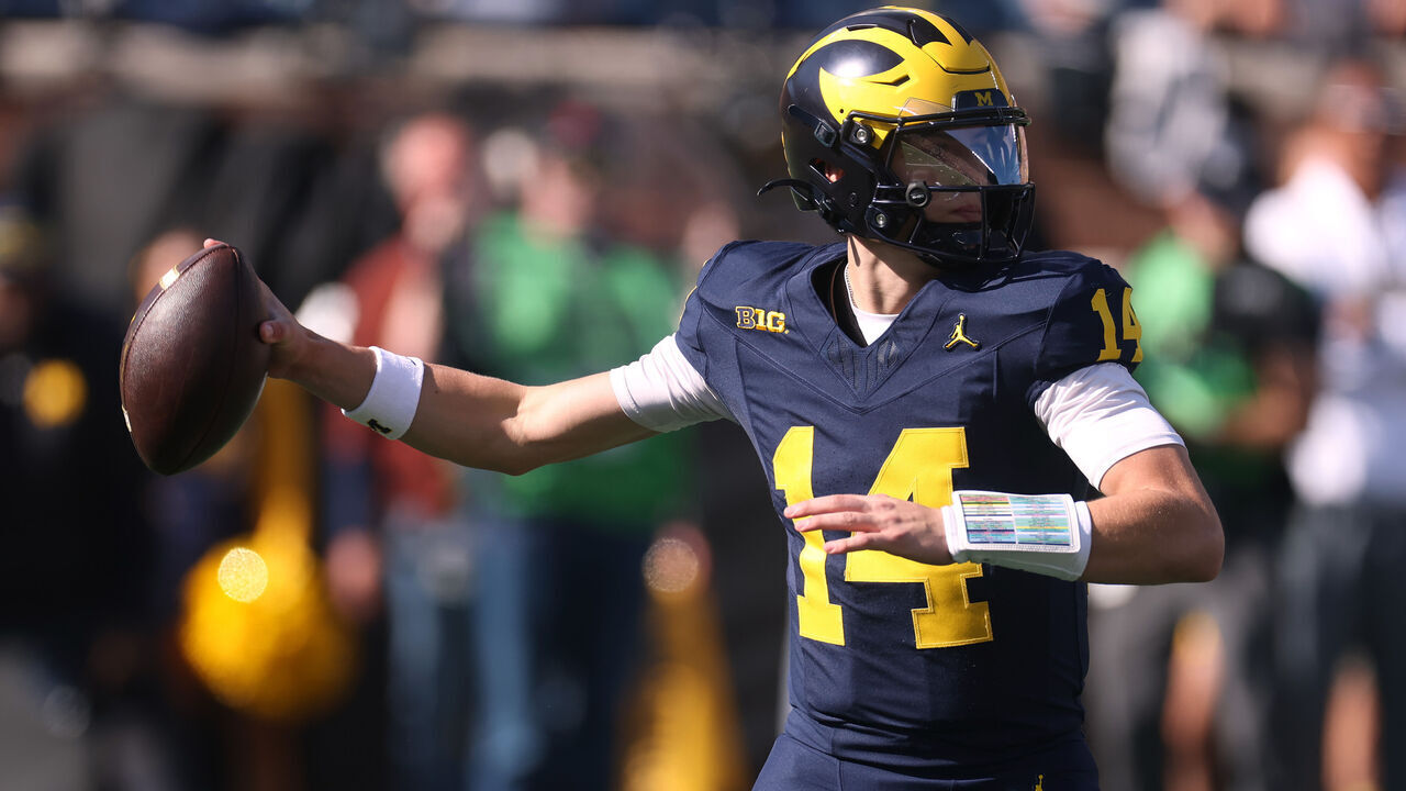 ANN ARBOR, MICHIGAN - OCTOBER 24: Tommy Carr #14 of the Michigan Wolverines throws a first half pass against the Indiana Hoosiers at Michigan Stadium on October 24, 2026 in Ann Arbor, Michigan.