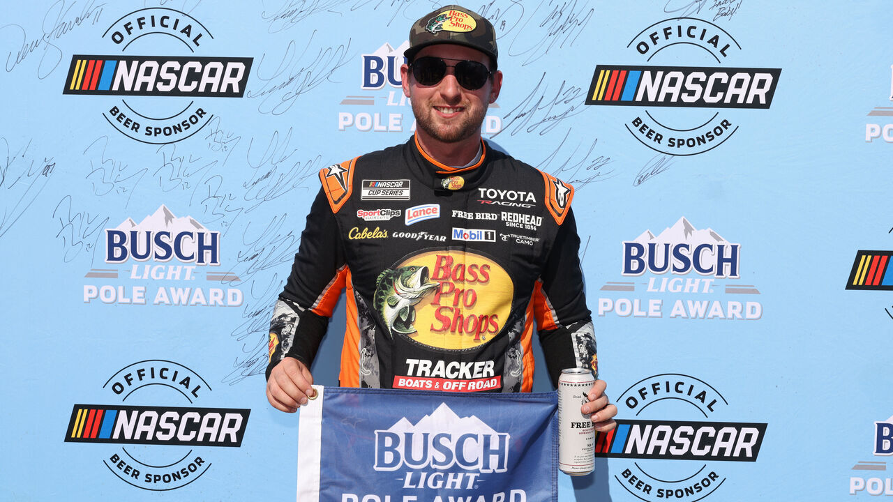 TALLADEGA, ALABAMA - OCTOBER 24: Chase Briscoe, driver of the #19 Bass Pro Shops Toyota, poses for photos after winning the pole award during qualifying for the NASCAR Cup Series YellaWood 500 at Talladega Superspeedway on October 24, 2026 in Talladega, Alabama.
