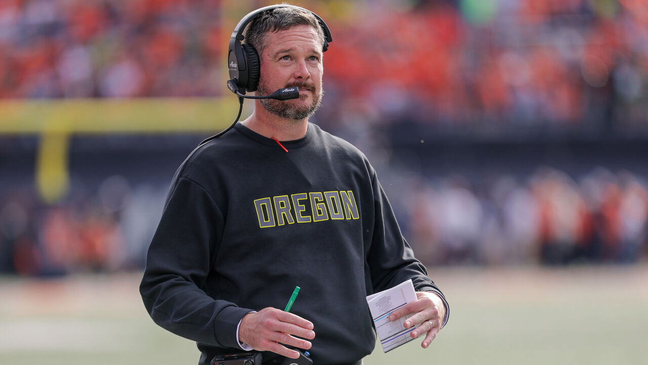 CHAMPAIGN, ILLINOIS - OCTOBER 24: Dan Lanning head coach of the Oregon Ducks looks up at the scoreboard during the first half against the Illinois Fighting Illini at Memorial Stadium on October 24, 2026 in Champaign, Illinois.