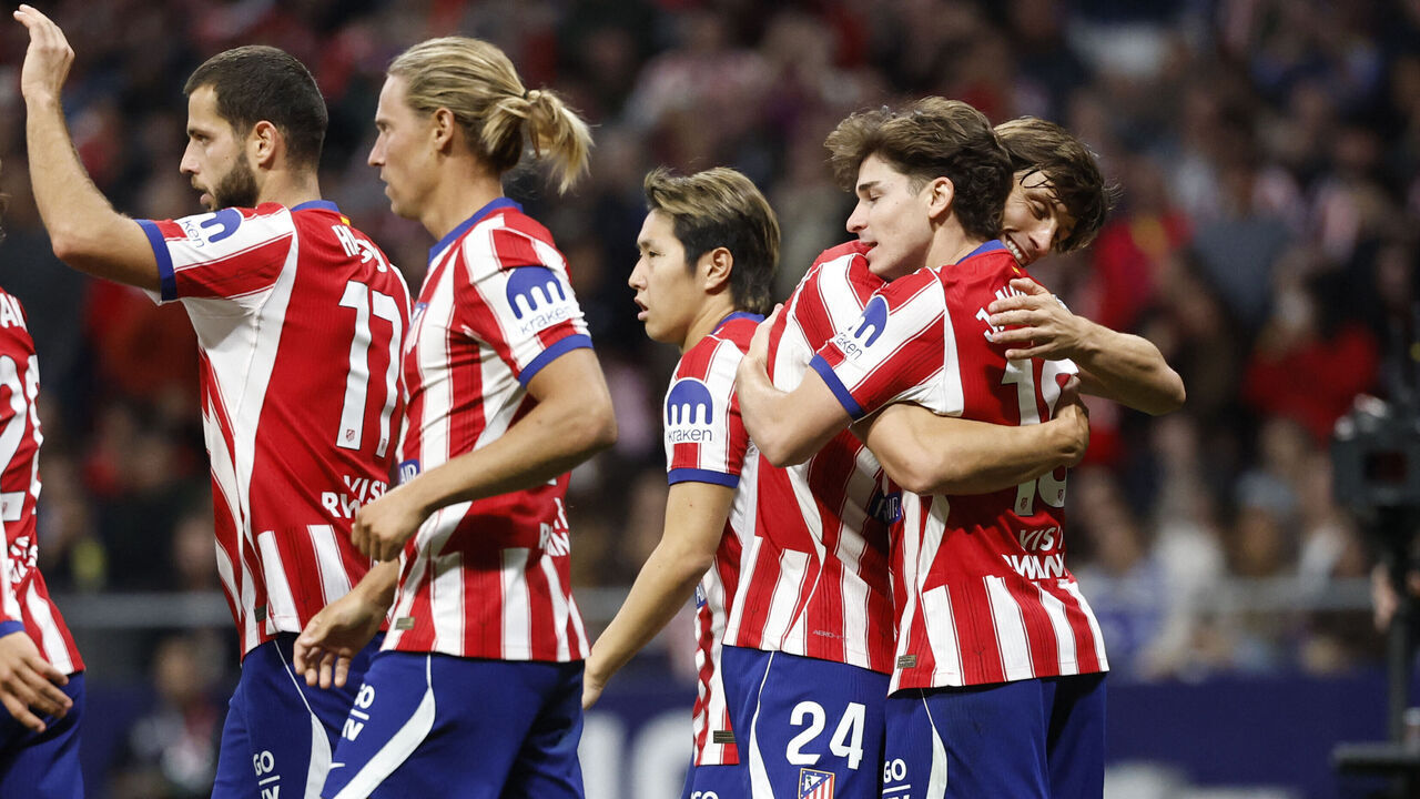 Atletico Madrid's Argentine forward #19 Julian Alvarez (R) hugs Atletico Madrid's Spanish defender #24 Robin Le Normand as he celebrates scoring the opening goal during the Spanish league football match between Club Atletico de Madrid and RC Deportivo de la Coruna at Metropolitano Stadium in Madrid on October 24, 2026.